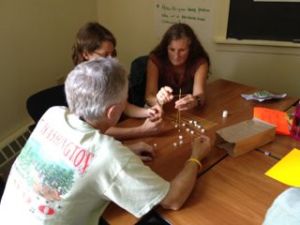 Teachers working on the marshmallow challenge